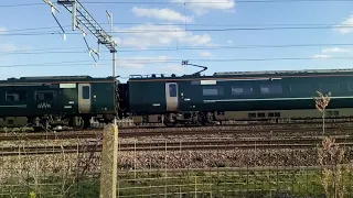 A Class 800 IET heading out of Swindon passing Swindon Works using electricity.