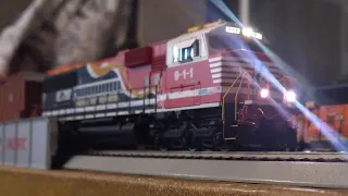 NS 911 leads 3 box cars on my ho scale train set