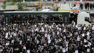 Thousands attend funeral procession as Iran buries President Raisi