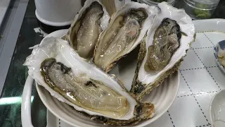 Japanese Raw Oysters and Shellfish called Thubugai.Japanese Street Food in Hokkaido,Sapporo.牡蠣とツブ貝