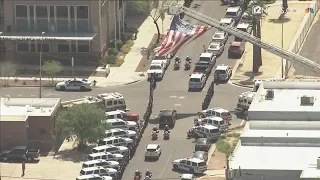 RAW: Honor guard escorts body of Phoenix police Officer Paul Rutherford to medical examiner's office