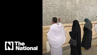 Hajj pilgrims perform the stoning ritual at Jamrat Al Aqabah