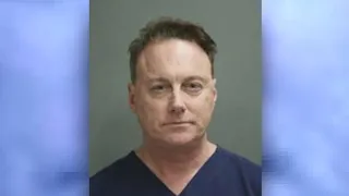 Doctor charged with assaulting 9 men