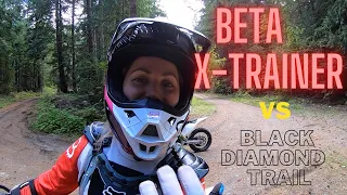 Female rider on Beta X-Trainer tackles a Black Diamond Trail