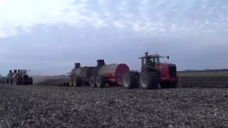 Two Versatile 400 tractors pulling Nuhn manure tankers in Iowa