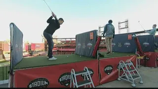 Golfers tee off at Busch Stadium