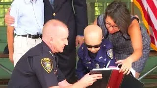 Boy with cancer becomes honorary cop