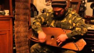 Roman Tunyakin is playing gusli (Russian cymbal) and singing old Russian folk knight ballad