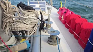 Custom 2 piece shade tarps on sailboat made from old sail material C&C 39