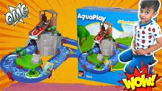 Adam Playing With Aquaplay - Adventureland Water Park Toy Set