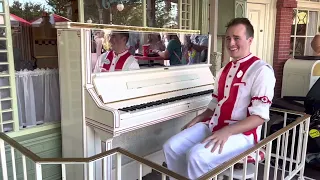 The Amazing Grayson playing piano at Casey's Corner in Magic Kingdom