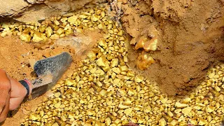 lucky today! digging gold treasure under stone at mountain near the river side, mining exciting