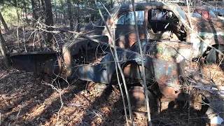 Vintage Old Jeep found abandoned in an overgrown junkyard.