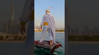 Man in Aladdin costume rides through Dubai on 'magic carpet'.