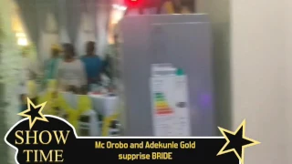 Mc orobo suprises bride with Adekunle Gold