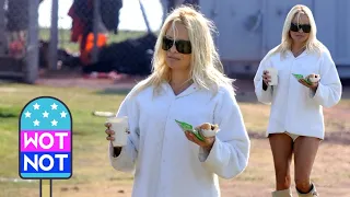 Pamela Anderson Plays with Her Famous Blonde Hair and Grabs a Hot Dog