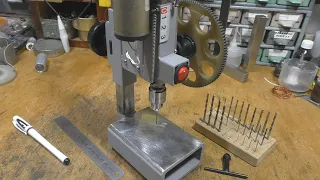 Mini drilling machine made from steel profiles.