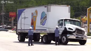 18 wheeler gets tangled in power lines