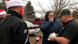 Couple washing dishes in the shower sobs when surprised with Secret Santa gift