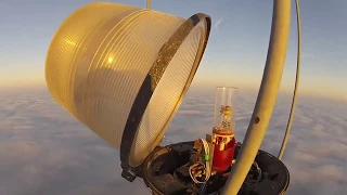 Changing a Bulb Atop a 2000 Ft Tower Looks As Crazy As It Sounds ...