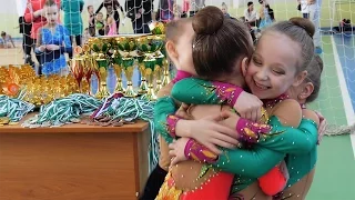 Rhythmic gymnastics / The girl is congratulated after the first performance