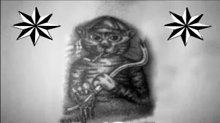 Что значит тюремная татуировка, где кот держит в лапах связку ключей?