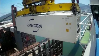 Accuracy of setting into place is amazing! Loading 40ft fridge-containers on a container ship