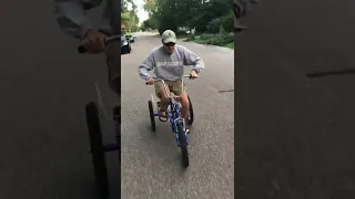 My dad trying to do a wheelie on a tricycle