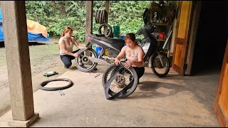 Mechanic girl repairs puncture motorbike and replace bearings