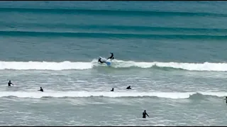 Near collision with two surfers on the same wave at Muizenberg beach! captured on live stream webcam