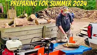 Splitting/stacking silver maple for summer 2024 campfire wood.