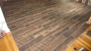 Wood look plank tile installation time lapse on Schluter Ditra with T-Lock™