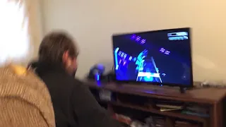 My dad getting 100%fc on doll by foo fighter.      Rock band 4