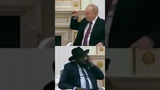 Putin Shows South Sudan President How to Put on Translation Earpiece