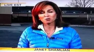 News reporter smiling during child suicide report