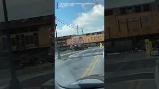 YIKES! Three people narrowly escaped a vehicle stuck on railroad tracks before it was hit by a train