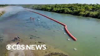 Justice Department sues Texas over floating border barrier in Rio Grande