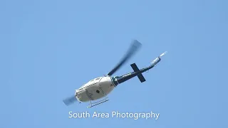 Bell UH-1 Hueys passing by