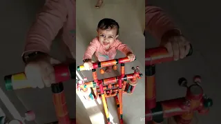 Aadhrit play with wooden walker
