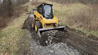 No Mini Excavator ; Skid steer CAT 242b instead ( driveway repair )