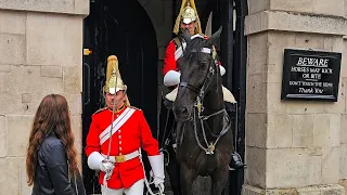 DISRESPECTFUL IDIOT TOURIST CAN'T WAIT FOR HER PICTURE and interrupts the Guard at Horse Guards!