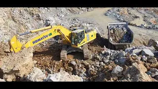 Komatsu PC500 LC Excavator loading dump trucks