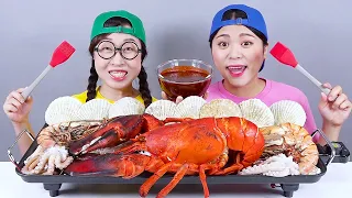 Pedas makanan laut rebus Lobster Mukbang DONA Indonesia