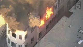 Massive fire engulfs apartment building in Koreatown