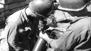 United States soldiers prepare and fire mortar during the Korean War. HD Stock Footage