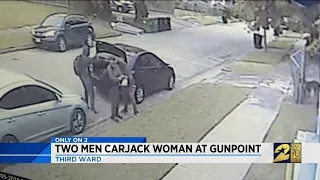 Two men carjack woman at gunpoint