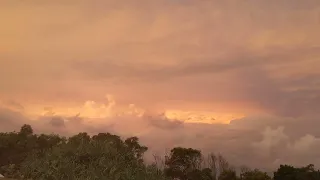Timelapse of clouds at sunset over the beach
