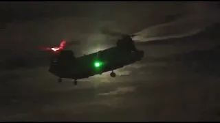 IAF CH-47 Chinook Helicopter hovering in dark.