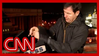 CNN reporter stops mid reporting to put on gear after hearing blasts