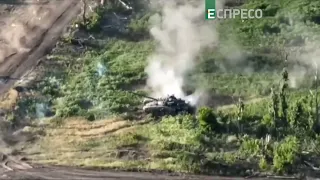 Russian tank destroyed by Ukrainian infantry, as seen by drone. Historical footage 2022